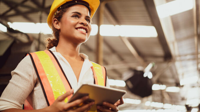 Portrait,Of,An,Industrial,Woman,Worker,Standing,With,A,Big